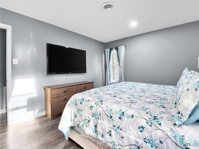 bedroom featuring hardwood / wood-style floors