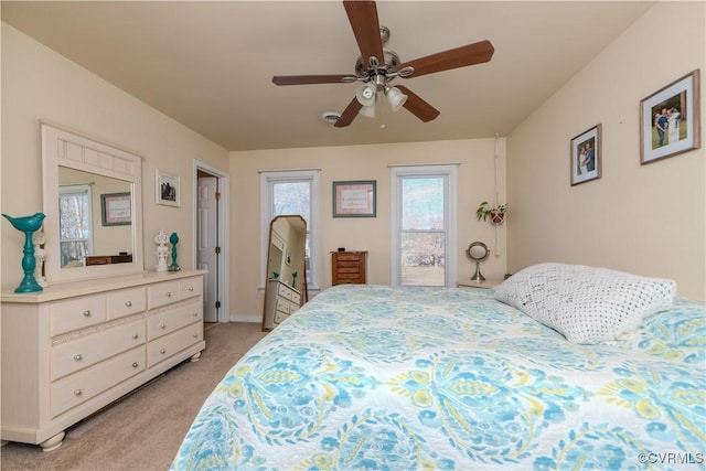 carpeted bedroom with ceiling fan