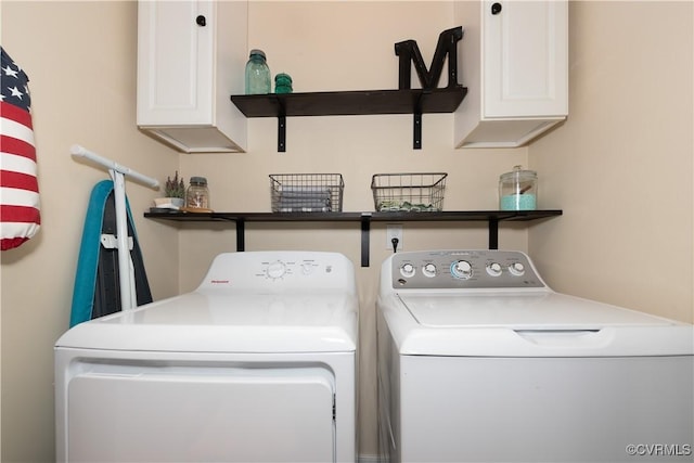 washroom with cabinets and independent washer and dryer