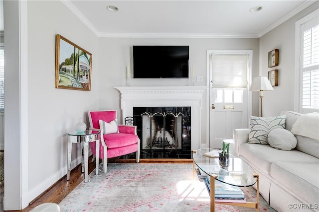 living room featuring crown molding and hardwood / wood-style floors