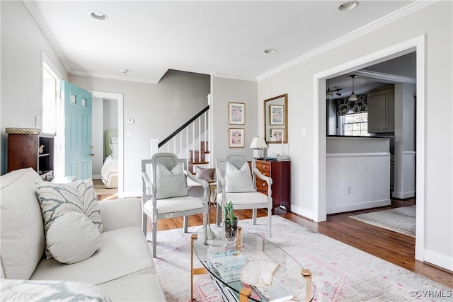 living room featuring crown molding and hardwood / wood-style floors