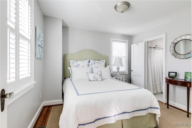 bedroom featuring dark wood-type flooring