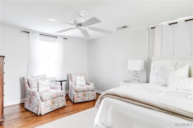 bedroom featuring hardwood / wood-style flooring and ceiling fan