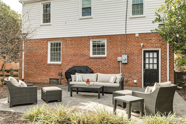 rear view of house featuring an outdoor hangout area and a patio area