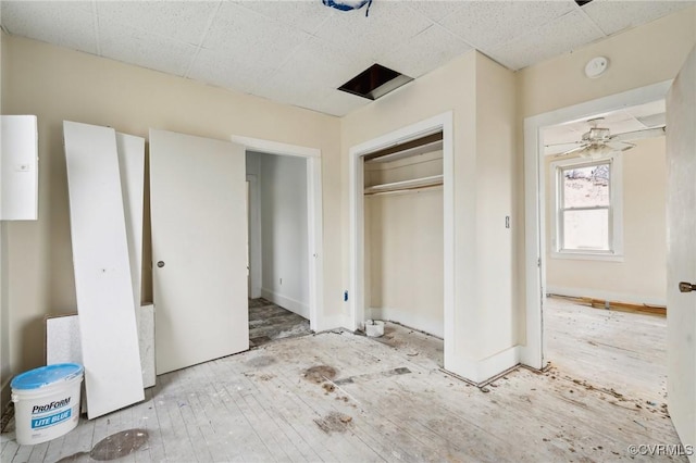 unfurnished bedroom featuring wood-type flooring and a closet