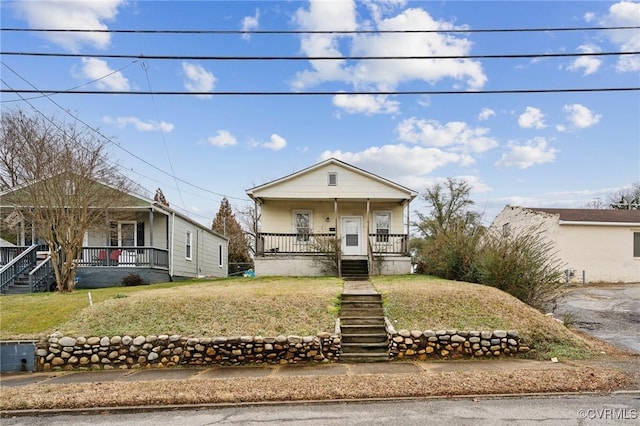 view of front of house featuring a porch and a front yard