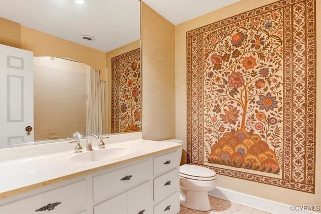 bathroom with toilet, visible vents, and vanity