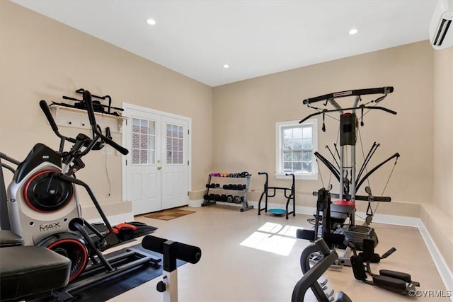 exercise room with recessed lighting, french doors, a wall unit AC, and baseboards