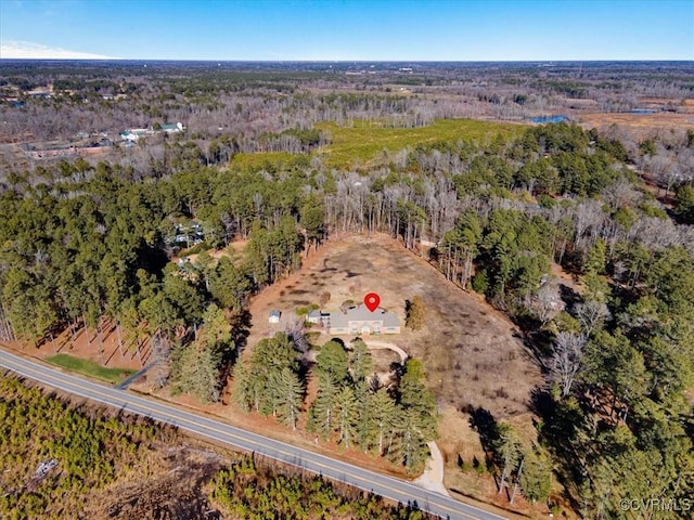 aerial view featuring a view of trees