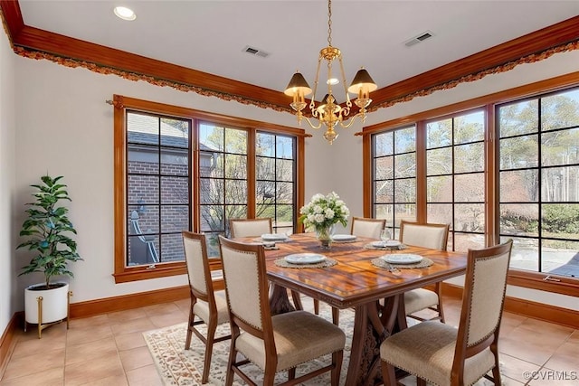 dining space featuring ornamental molding, a chandelier, visible vents, and baseboards