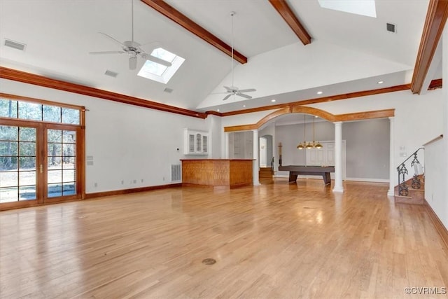 unfurnished living room with arched walkways, high vaulted ceiling, ceiling fan, visible vents, and beamed ceiling