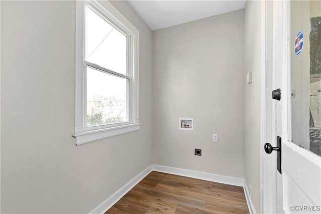 clothes washing area with electric dryer hookup, hardwood / wood-style floors, and hookup for a washing machine