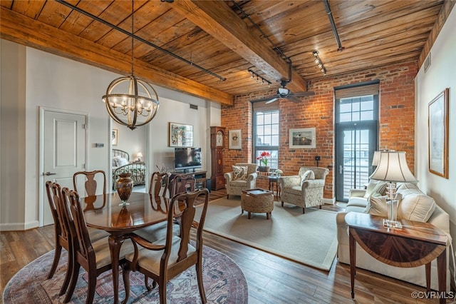 dining area featuring beamed ceiling, brick wall, hardwood / wood-style floors, and wooden ceiling