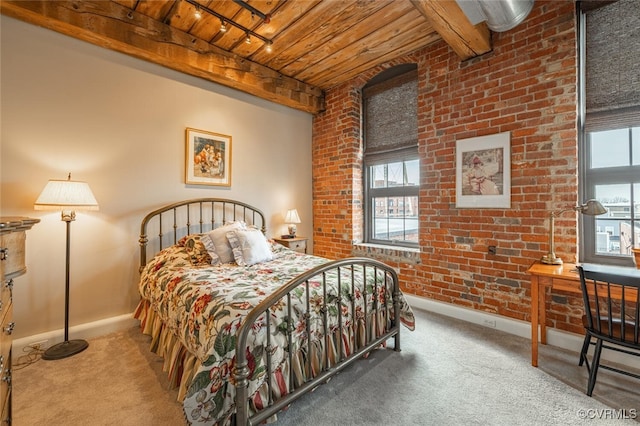 carpeted bedroom featuring brick wall, beam ceiling, multiple windows, and wooden ceiling