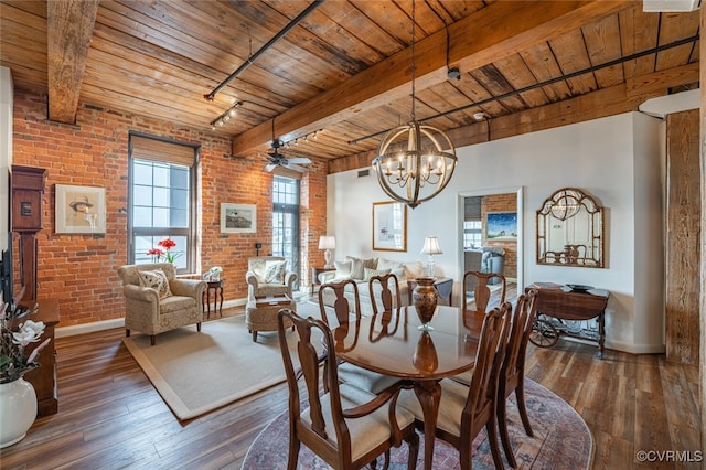 dining area featuring wood ceiling, beam ceiling, dark hardwood / wood-style floors, track lighting, and brick wall