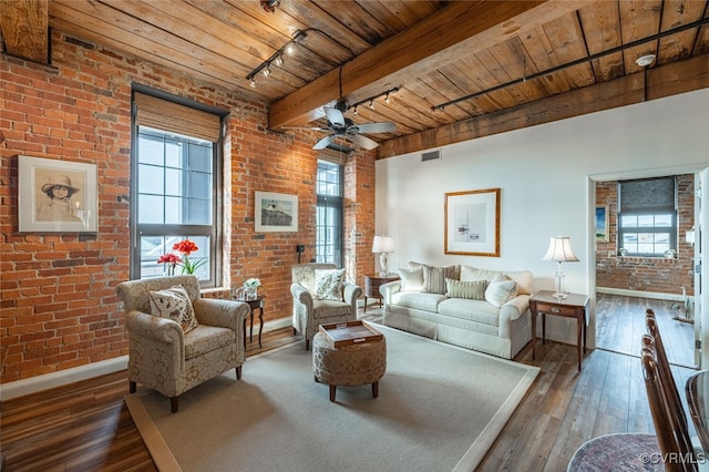 living room with wood ceiling, track lighting, brick wall, and dark hardwood / wood-style floors