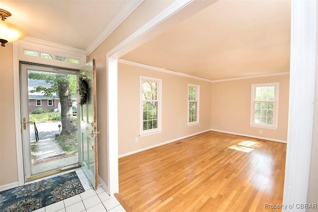 entryway with crown molding and light wood-type flooring