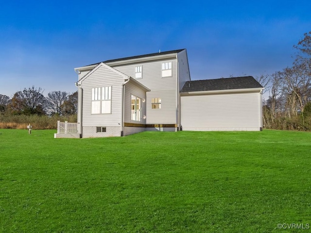 rear view of house with a lawn