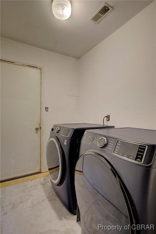 washroom with separate washer and dryer