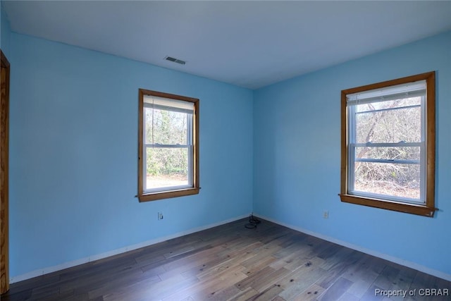 empty room with wood-type flooring