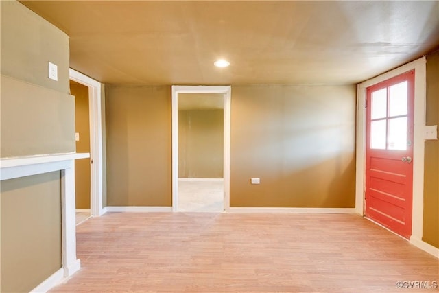 unfurnished room with light wood-type flooring