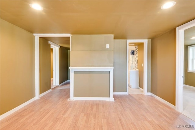 spare room featuring light hardwood / wood-style flooring