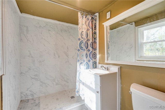 bathroom featuring vanity, curtained shower, and toilet