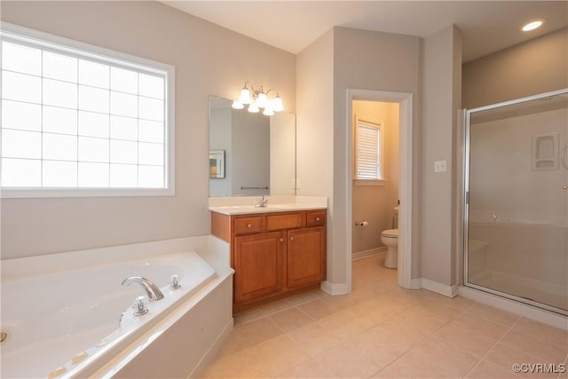 full bathroom featuring vanity, toilet, tile patterned flooring, and shower with separate bathtub