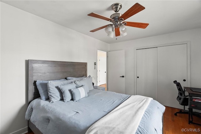 bedroom featuring hardwood / wood-style flooring, a closet, and ceiling fan