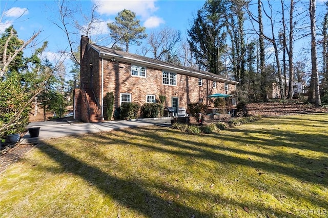 rear view of house with a lawn