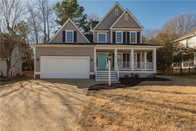 view of front of home with a garage, a porch, and a front yard