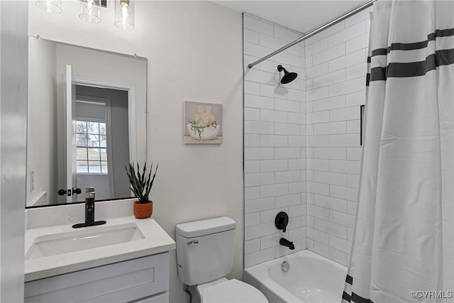 full bathroom featuring vanity, shower / bath combo, and toilet