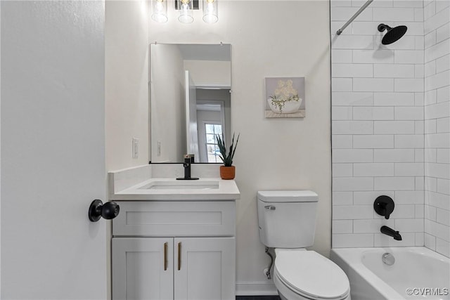 full bathroom with vanity, toilet, and tiled shower / bath combo