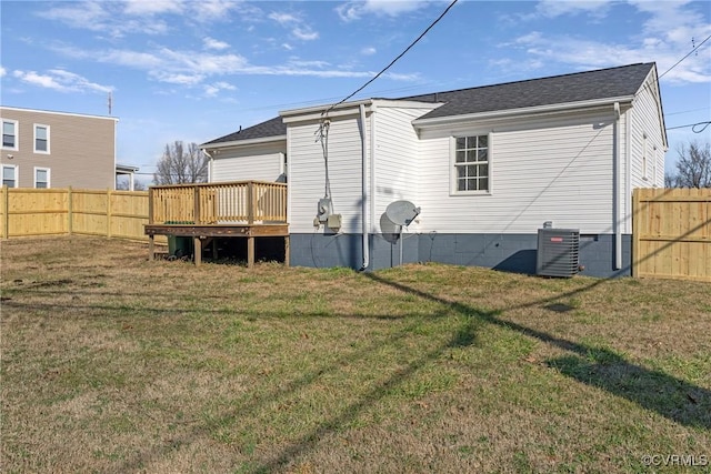 back of house with a yard, central air condition unit, and a deck