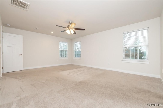 carpeted empty room with ceiling fan