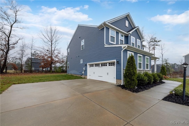 view of property exterior featuring a garage and a yard