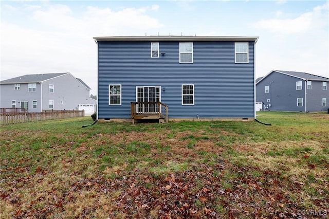 rear view of property with a yard