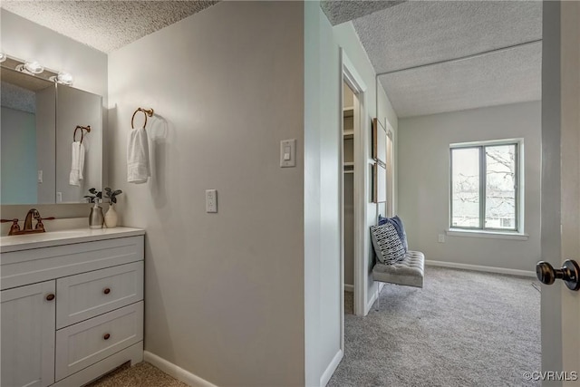 bathroom with vanity and a textured ceiling