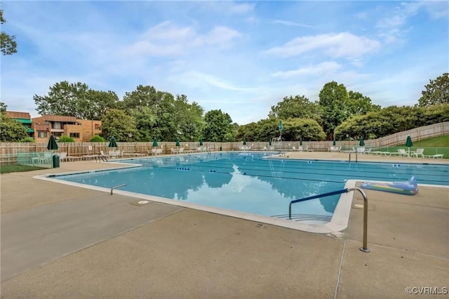 view of swimming pool with a patio