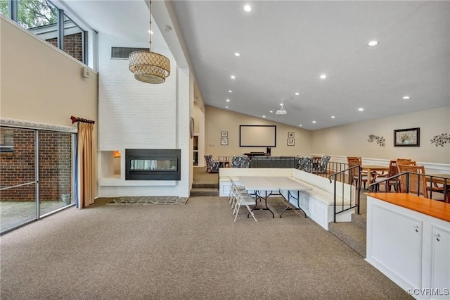 interior space with a fireplace, light carpet, and white cabinets