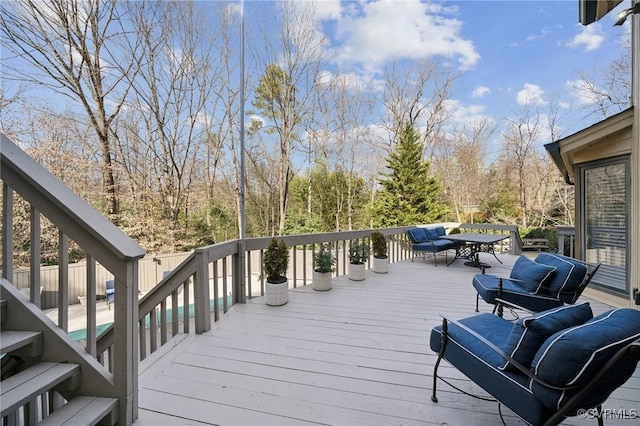 wooden terrace with outdoor dining area