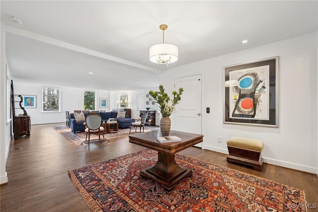 interior space featuring a notable chandelier, dark wood-type flooring, recessed lighting, and baseboards