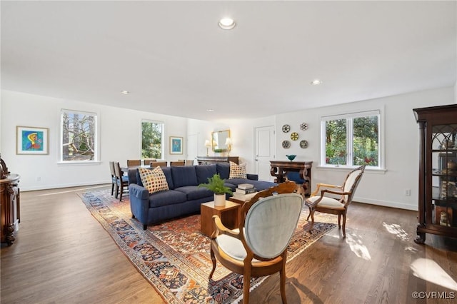 living room with recessed lighting, wood finished floors, and baseboards