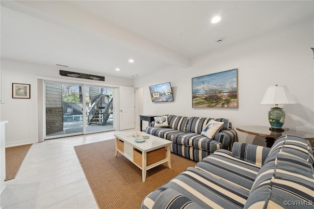 living area featuring baseboards, beam ceiling, and recessed lighting