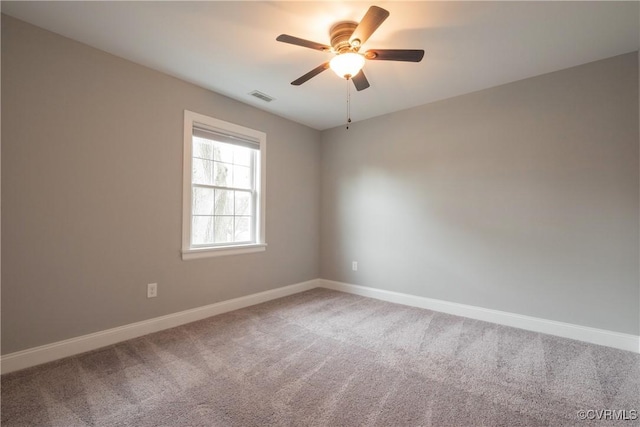 carpeted empty room with ceiling fan