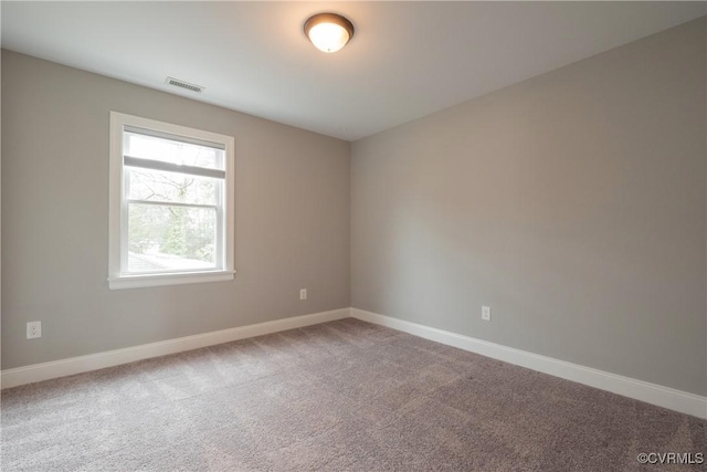 unfurnished room featuring carpet