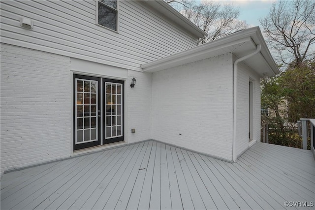 wooden deck featuring french doors