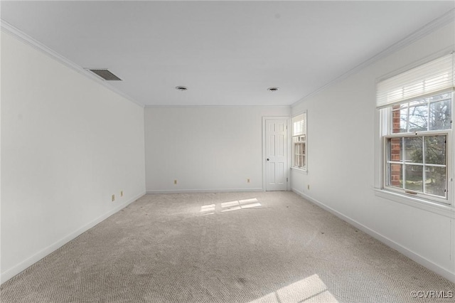 carpeted spare room with crown molding