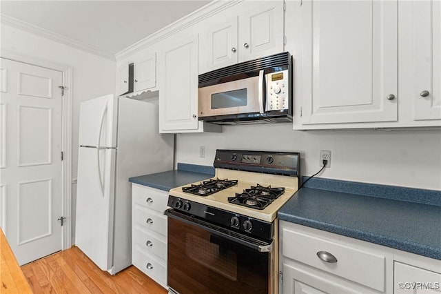 kitchen featuring ornamental molding, light wood-type flooring, white cabinets, and white appliances