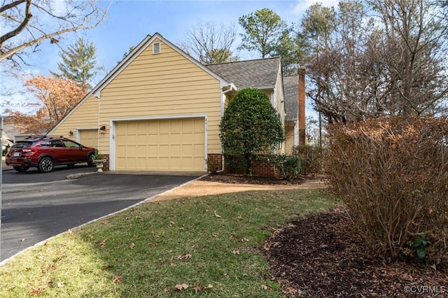 view of side of home with a garage